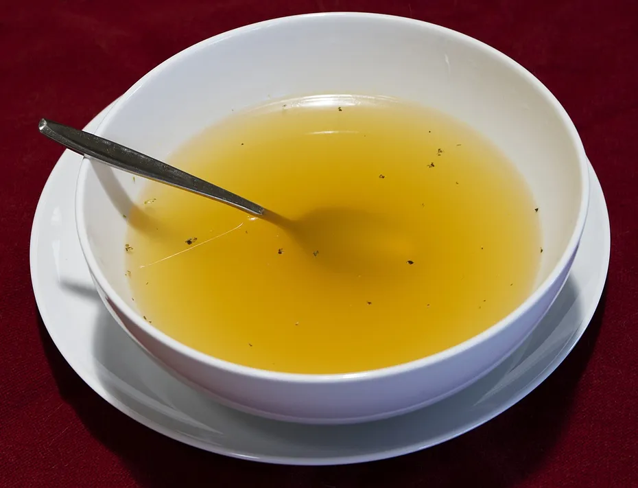 chicken broth on a bowl