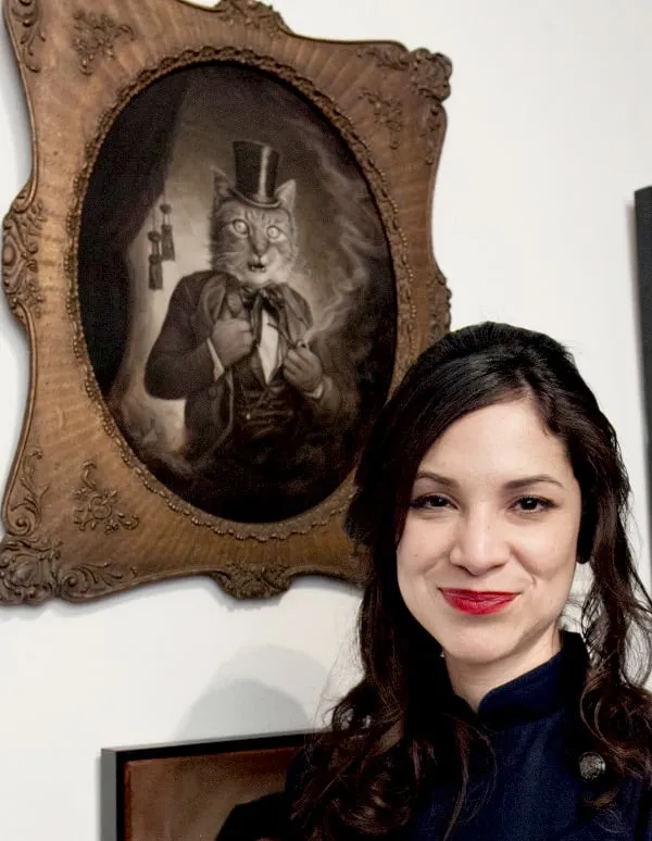 Sonya Palencia with her painting, "Bustopher Jones