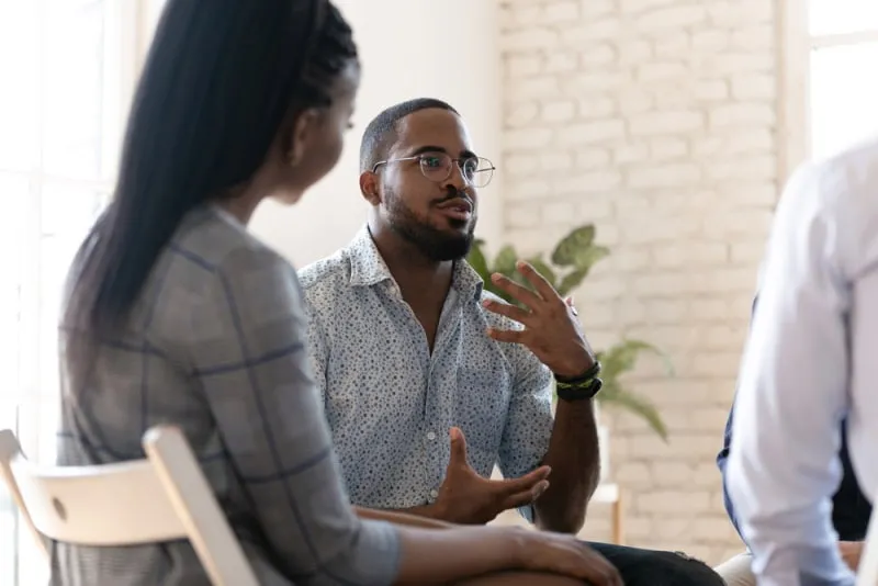 man sharing thoughts to his friends