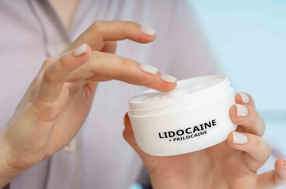 a woman using EMLA (Lidocaine + Prilocaine) A topical anesthetic cream used to numb the skin