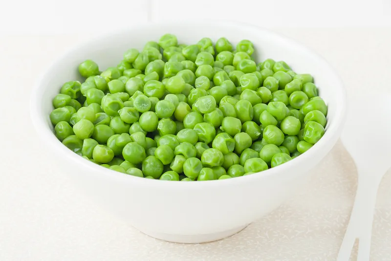 a bowl of green peas