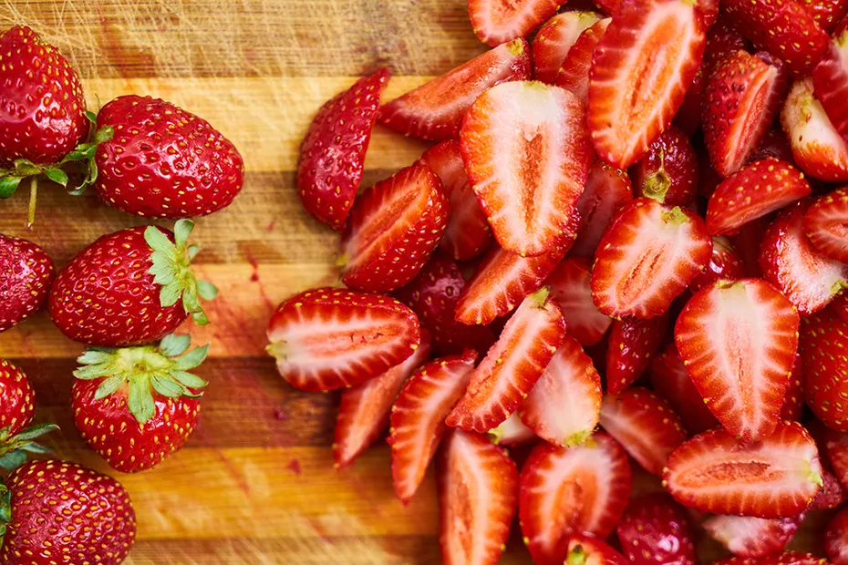 slices of strawberries on chopping board