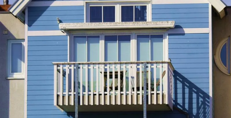 blue house with balcony