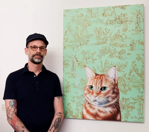 Michael Caines stands by his painting of a (smoking) orange tabby.
