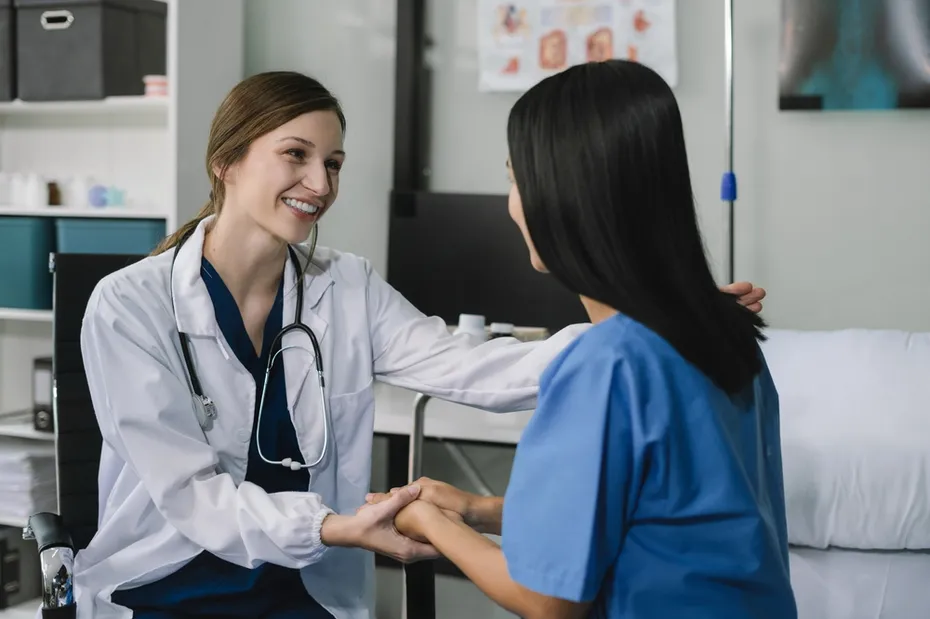 doctor talking with woman patient for monitoring and check up after surgery