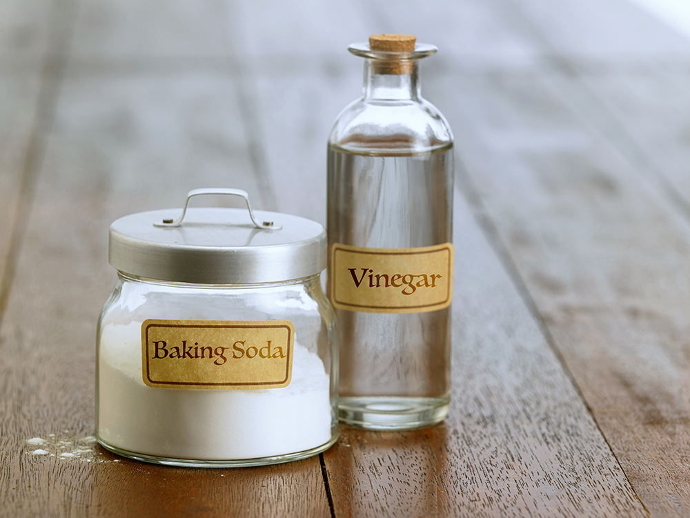 jar of baking soda and bottle of vinegar