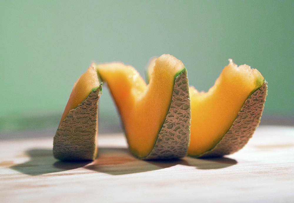 three slices of cantaloupe