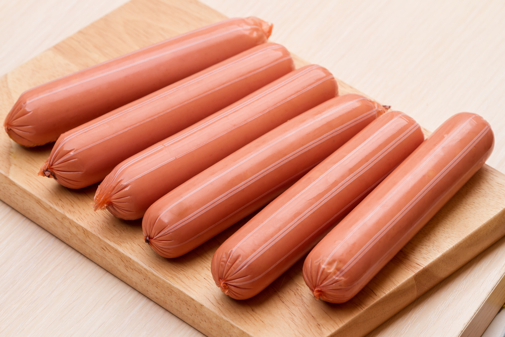 vienna sausage on wooden cutting board