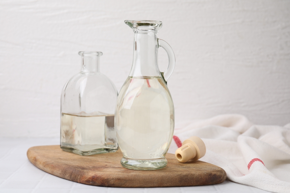 vinegar in glass jug and bottle