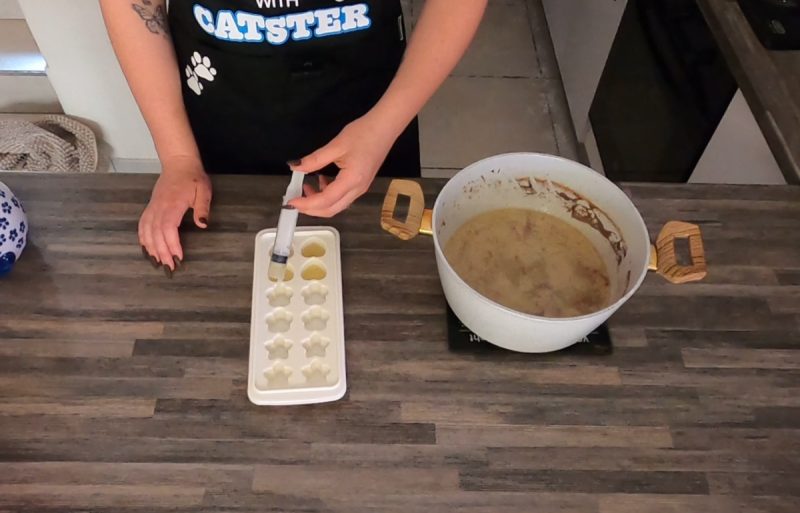 Crystal pouring the leftover water into an ice-cube tray using syringe