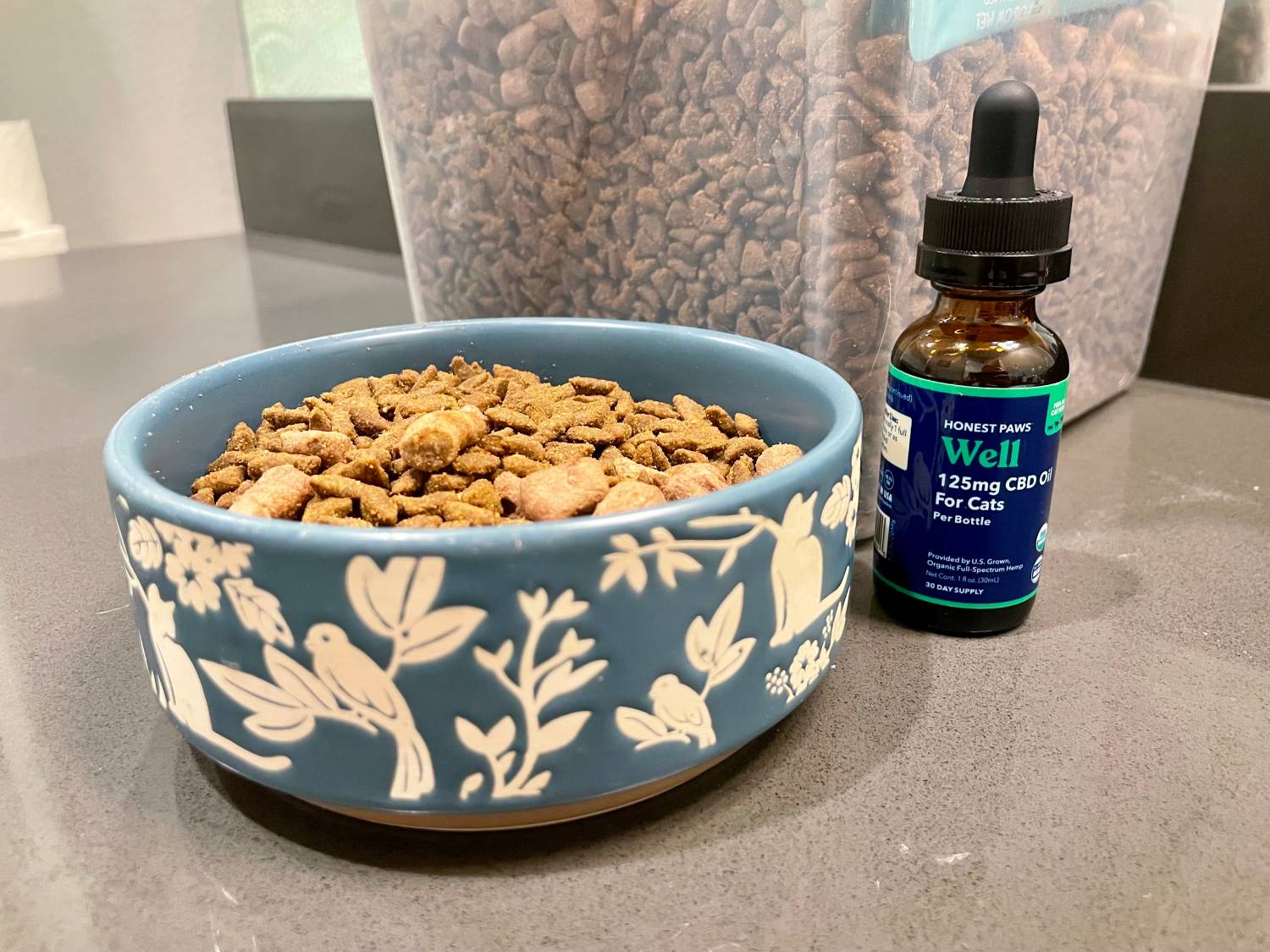 Honest Paws Well CBD Oil Tincture for Cats Review - the product with kibbles
