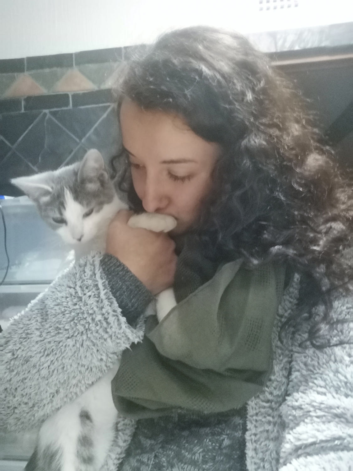 Isabel hugging her cat